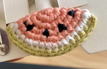 Crochet watermelon slice for applique, hairclips or earrings.